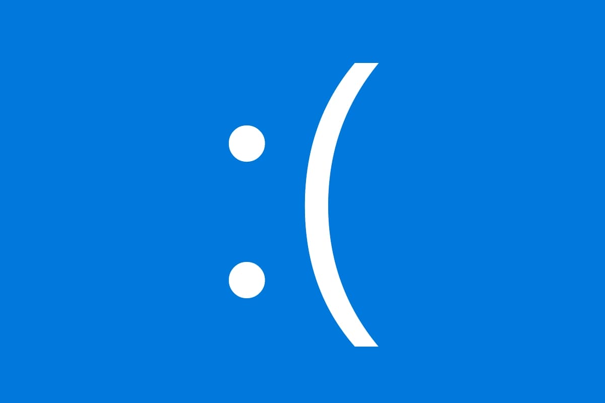 Representación minimalista de la Pantalla Azul de la Muerte, el icónico error de Windows, con una gran cara triste sobre un fondo azul.